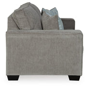 Ashley Furniture Altari loveseat with plush cushions and tapered wooden legs, shown in a neutral fabric upholstery.
