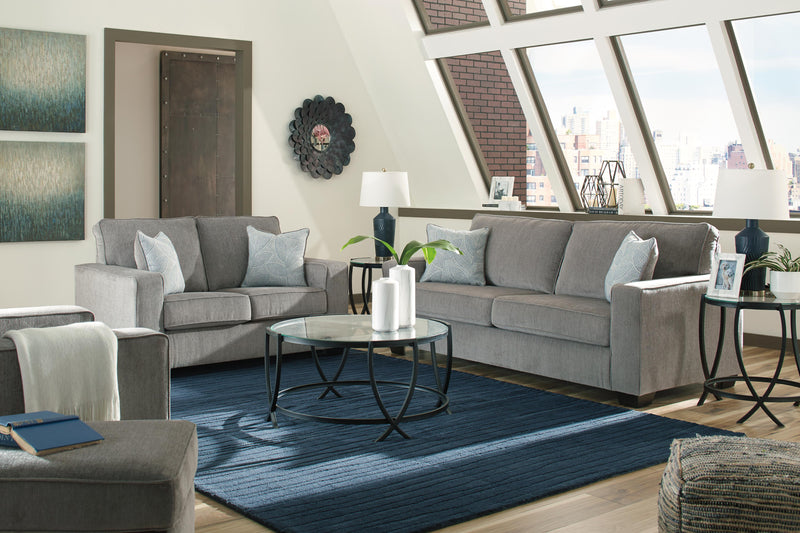 Ashley Furniture Altari living room set with sofa and armchair in a modern design, featuring plush cushions and neutral upholstery.