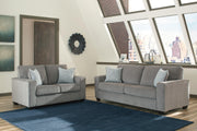 Ashley Furniture Altari living room set with sofa, loveseat, and coffee table in a modern, stylish living room arrangement.