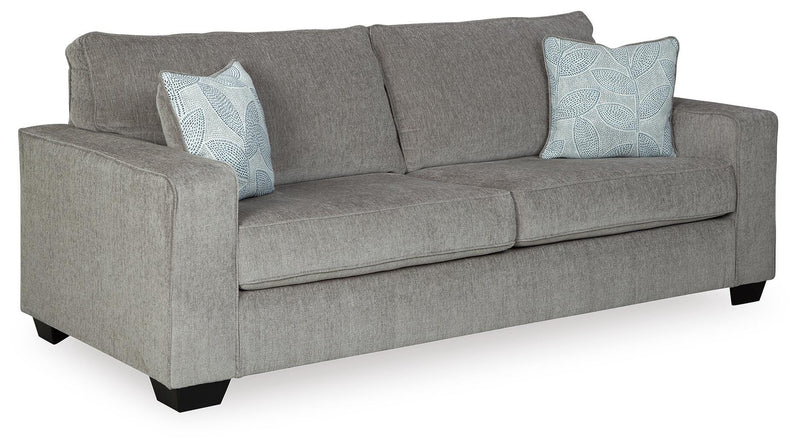 Ashley Furniture Altari Sofa in a stylish fabric with plush cushions, shown from an angled side view.