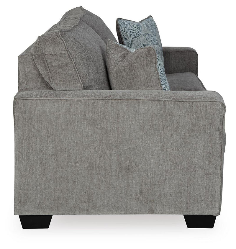 Ashley Furniture Altari sofa sleeper with beige fabric and wooden legs, shown in open position revealing sleeping surface.