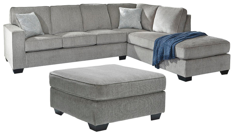 Ashley Furniture Altari living room set with plush sofa and matching armchair, beige upholstery and modern design.