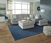 Ashley Furniture Altari living room set with sofa and loveseat in a modern design, featuring neutral upholstery and stylish cushions.