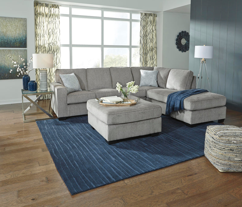 Ashley Furniture Altari living room set with sofa and loveseat in a modern design, featuring neutral upholstery and stylish cushions.