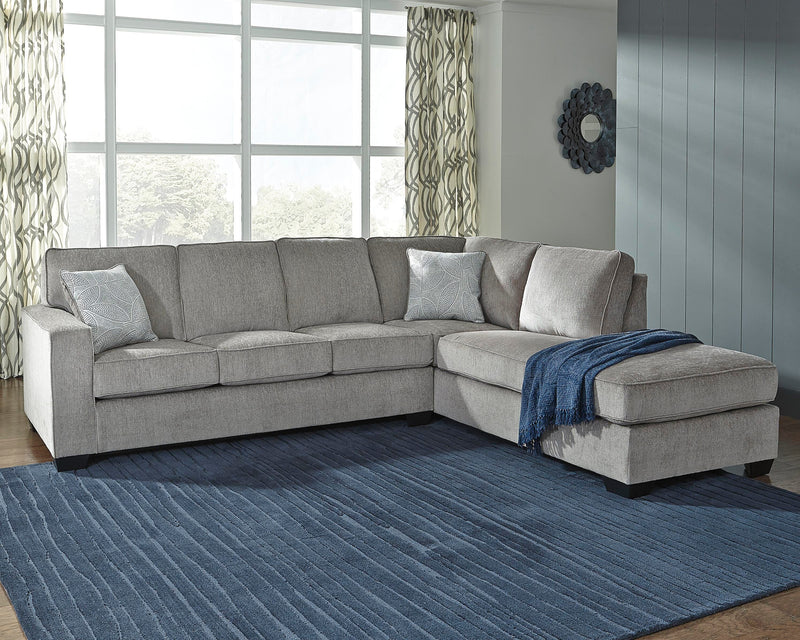 Ashley Furniture Altari sectional with chaise, showing plush fabric upholstery and modern design in a spacious living room setting.