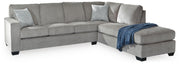 Ashley Furniture Altari sleeper sectional with chaise, featuring plush upholstery and a spacious seating area.