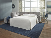 Ashley Furniture Altari living room set with sofa, loveseat, and coffee table in a modern design, shown in a cozy home setting.
