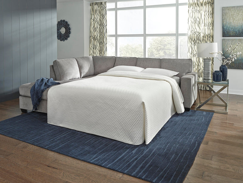 Ashley Furniture Altari living room set with sofa, loveseat, and coffee table in a modern design, shown in a cozy home setting.