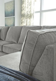 Ashley Furniture Altari sectional with chaise, showing a modern fabric sofa with a spacious seating area and attached chaise lounge.