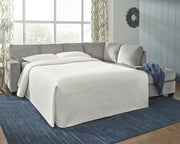 Ashley Furniture Altari Sleeper Sectional with Chaise, beige fabric, modern design, with plush cushions and a convertible sleeper feature.