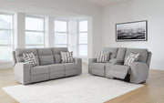 Ashley Furniture Biscoe living room set with beige upholstered sofa and armchair, featuring plush cushions and wooden legs.