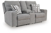 Ashley Furniture Biscoe power reclining loveseat shown from an angled view, featuring plush upholstery and reclining seats.