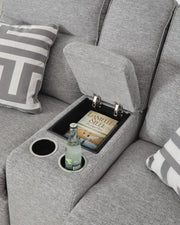 Ashley Furniture Biscoe power reclining loveseat with console, showing plush upholstery and built-in cup holders.