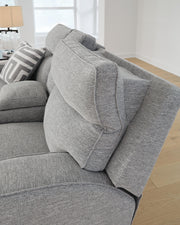 Ashley Furniture Biscoe power reclining loveseat with plush cushions and dark upholstery, perfect for comfortable living room seating.