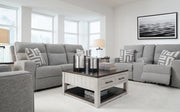 Ashley Furniture Biscoe Living Room Set with sofa and loveseat in a modern design, featuring neutral upholstery and plush cushions.