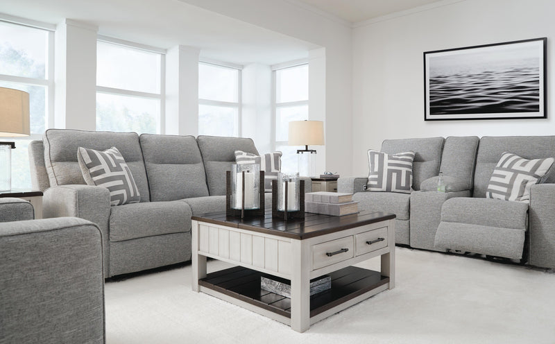 Ashley Furniture Biscoe Living Room Set with sofa and loveseat in a modern design, featuring neutral upholstery and plush cushions.