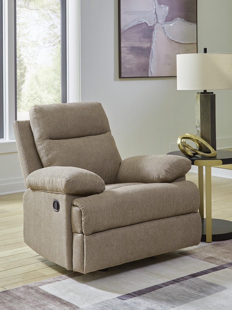 Ashley Furniture Side-Swipe Recliner in soft fabric with padded armrests and plush cushioning, shown from a side angle.