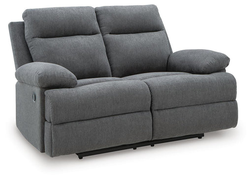 Ashley Furniture side-swipe reclining loveseat with plush fabric and overstuffed cushions, shown from an angled view.