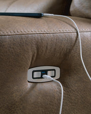 Ashley Furniture Beckley Place power reclining loveseat with console, featuring plush cushions and built-in USB ports.
