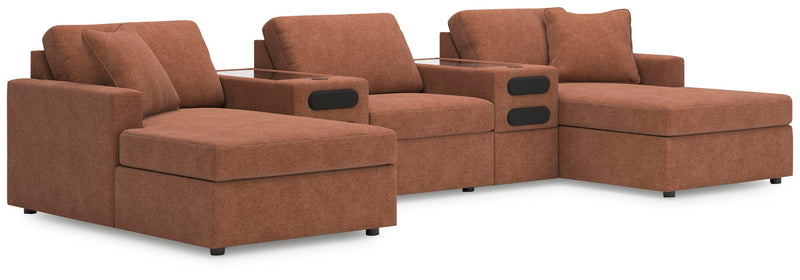 Ashley Furniture Modmax double chaise sectional with integrated audio consoles, featuring plush cushions and modern design.