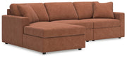 Ashley Furniture Modmax sectional with chaise, featuring plush cushions and modern design in a stylish living room setting.