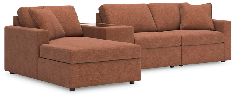 Ashley Furniture Modmax sectional with chaise, featuring plush cushions and modern design in a spacious living room setting.