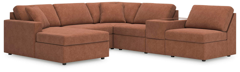 Ashley Furniture Modmax sectional with chaise, featuring plush gray upholstery and modern design, shown with extended chaise in living room.
