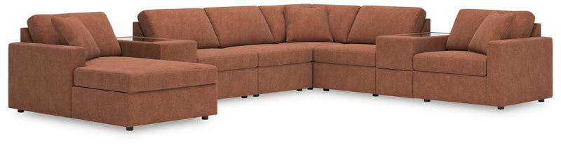 Ashley Furniture Modmax sectional with chaise, featuring plush cushions and modern design, shown in a cozy living room setting.