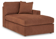 Ashley Furniture Modmax sectional with chaise, showing a modern L-shaped sofa with plush cushions and fabric upholstery.