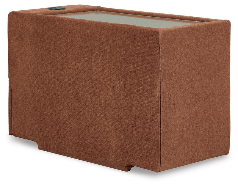 Ashley Furniture Modmax sectional with built-in audio and storage consoles, featuring a modern, balanced design and plush upholstery.