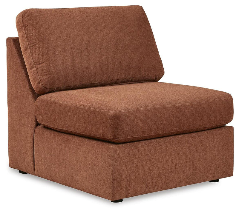 Ashley Furniture Modmax sectional with chaise, angled view showing plush fabric, modern design, and spacious seating.
