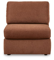 Ashley Furniture Modmax sectional with built-in audio and storage consoles, featuring a modern, balanced design.
