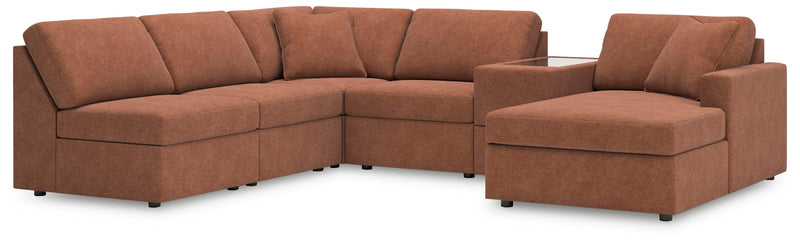 Ashley Furniture Modmax sectional with chaise, featuring modern design and plush upholstery in a stylish living room setting.