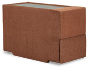 Ashley Furniture Modmax balanced sectional with built-in audio, storage consoles, and a modern design, viewed from an angle.