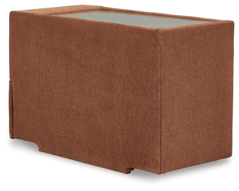Ashley Furniture Modmax sectional with built-in audio and storage consoles, featuring plush cushions and modern design.