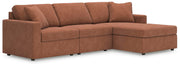 Ashley Furniture Modmax sectional with chaise, featuring modern design and plush upholstered seating in a stylish living room setting.
