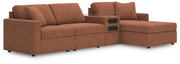 Ashley Furniture Modmax sectional with chaise, showcasing a modern fabric sofa with a spacious chaise lounge in a stylish living room setting.