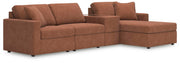 Ashley Furniture Modmax sectional with chaise, featuring plush upholstery and modern design, shown in a spacious living room setting.
