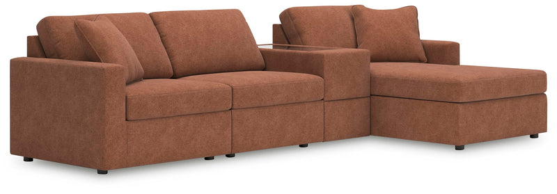 Ashley Furniture Modmax sectional with chaise, featuring plush upholstery and modern design, shown in a spacious living room setting.
