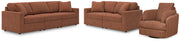 Ashley Furniture Modmax living room set with sofa and armchair, featuring modern upholstery and sleek design for contemporary living spaces.