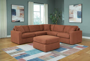 Ashley Furniture Modmax living room set with sofa and armchair, upholstered in neutral fabric, modern design for stylish living spaces.
