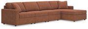 Ashley Furniture Modmax sectional with chaise showing a modern gray fabric sofa with cushions and a spacious design.