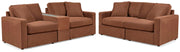 Ashley Furniture Modmax living room set with sofa and matching chairs in a modern design, shown in a stylish living room setting.