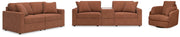 Ashley Furniture Modmax living room set with sofa, loveseat, and armchair in neutral fabric, arranged in a modern living space.