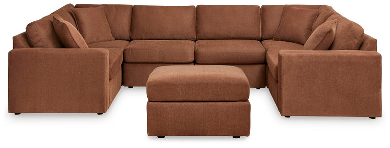 Ashley Furniture Modmax living room set featuring a sofa and matching armchair with modern upholstery and sleek design.