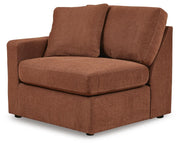 Ashley Furniture Modmax balanced sectional with built-in audio and storage consoles, shown from an angled view.