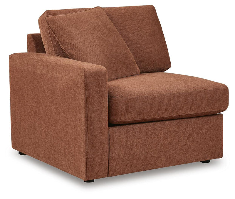 Ashley Furniture Modmax balanced sectional sofa with built-in audio and storage consoles, shown from an angled view.