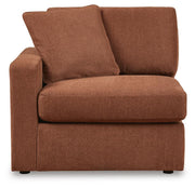 Ashley Furniture Modmax sectional with built-in audio, storage consoles, and plush seating, shown from a head-on angle.
