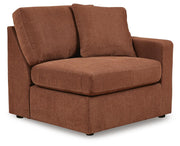 Ashley Furniture Modmax balanced sectional with built-in audio and storage consoles, shown from an angled view.