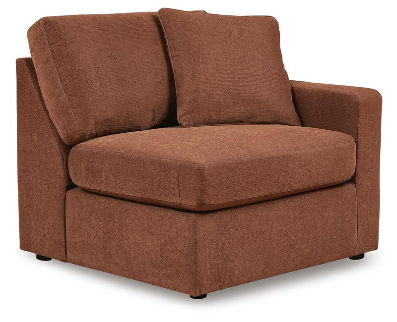 Ashley Furniture Modmax sectional with chaise, showing a modern L-shaped sofa with plush cushions and stylish design in an angled view.
